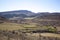 View of plow fields with the mountain range in the background