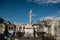 View of Poble Nou cemetery on a sunny day with historical statues and graves, with crosses and christian symbols and flowers.