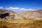 View point of arid mountain range valley in Southern Kyrgyzstan