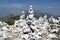 View point with white stone cairns on hiking trail Alta Via del Monte Baldo, ridge way in Garda Mountains