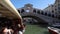 View of Ponte Rialto bridge from the Tragetto sailing on the Grand Canal, Venice Italy