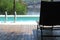 The view of pool and lounge chair and palm trees in vacation sumer