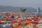 View of the port of Kwangyang , South Korea full of containers in terminal with mountain in background during rainy weather.