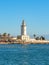 View of the port of Malaga. `Muelle Uno` shopping mall,Malagueta buildings and La Farola lighthouse