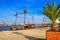 View of the port of Varna and the embankment with pleasure ships, harbor cranes in the background