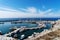 View on port of Vlichada town full with small fishing boats at Santorini island