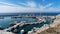 View on port of Vlichada town full with small fishing boats at Santorini island