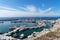 View on port of Vlichada town full with small fishing boats at Santorini island