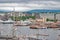 View of the port, wharf with steamships, yachts, boats and sailboats and coastal areas of one northern European city, sum