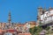 View at the Porto city, with Clerigos tower, baroque icon on Porto city, other buildings and blue sky