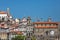 View at the Porto city, with Clerigos tower, baroque icon on Porto city, other buildings and blue sky