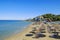 View of Porto Zoro beach with sunbeds and umbrellas