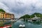 View of Portofino harbour with dark clouds