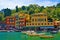 View of Portofino restaurants 2, on a blue sky day, Portofino, Liguria, Italy.