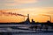 View of power plant and industry emissions during sunset