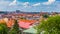 View of Prague Castle over red roof from Vysehrad area at sunset lights, Prague, Czech Republic. Scenic view of Prague city,