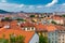 View of Prague Castle over red roof from Vysehrad area at sunset lights, Prague, Czech Republic. Scenic view of Prague city,