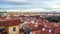 View of Prague over houses with red roofs. Amazing view from above at old historical quarter. Prague, Czech Republic. Prague is f