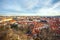 View of Prague over houses with red roofs. Amazing view from above at old historical quarter. Prague, Czech Republic. Prague is f