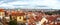 View of Prague over houses with red roofs. Amazing view from above at old historical quarter. Prague, Czech Republic. Prague is f