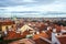 View of Prague over houses with red roofs. Amazing view from above at old historical quarter. Prague, Czech Republic. Prague is f