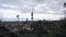 View of Prague TV tower over the roofs of the town on a cloudy day