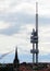 View of Prague TV tower over the roofs of the town on a cloudy day, Prague, Czech Republic