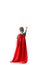View of preschooler boy in red hero cloak standing with fist up isolated on white