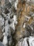 View of pristine winter landscape featuring snow covered rocky cliffs with white snow