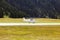 A view of a private plane taking off in the airport of St Moritz in spring time