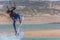 View of a professional sportsman practicing extreme sports Kiteboarding at the Obidos lagoon, Foz do Arelho, Portugal