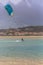View of a professional sportswoman practicing extreme sports Kiteboarding at the Obidos lagoon, Foz do Arelho, Portugal