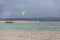 View of a professional sportswoman practicing extreme sports Kiteboarding at the Obidos lagoon, Foz do Arelho, Portugal