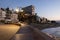 View of promenade and Bajondillo beach in Torremolinos just before sunrise. Costa del Sol