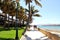 View of the promenade with beautiful palm trees in Castillo Caleta de Fuste,Fuerteventura, Canarias