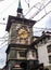 View of public tram overhead wire lines in front of the famous medieval Zytglogge Astronomical clock tower in middle of old town