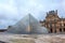 View Pyramid at courtyard of Paris Louvre Museum. Louvre Museum is one of the largest and most visited museums worldwide