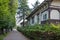 View of a quiet pedestrian street without people with a historic house