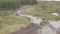 View of race track on quad bikes. Clip. Top view of quad bikes passing puddles of mud at races. Cross-country motorcycle