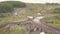 View of race track on quad bikes. Clip. Top view of quad bikes passing puddles of mud at races. Cross-country motorcycle