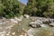 View of the Raganello River below il Ponte del diavolo pathway in Civita