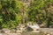 View of the Raganello River below il Ponte del diavolo pathway in Civita