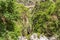 View of the Raganello River below il Ponte del diavolo pathway in Civita