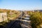 View on railway from high place and trees arround in summer or autumn day. Nice lanscape with city and nature