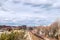 View of railway tracks, trains and downtown in the distance