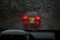 View from a rain-drenched windshield on a car in front.