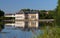 View of Rambouillet castle , XIV century, in picturesque Public Park in town of Rambouillet , 50 km southwest of Paris