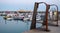 View of Ramsgate Royal Harbour taken in the early evening light, with the masts of the yachts reflected in the water.