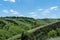 View ravine covered with greenery. Landscape valley with geological faults.