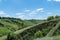 View ravine covered with greenery. Landscape valley with geological faults.